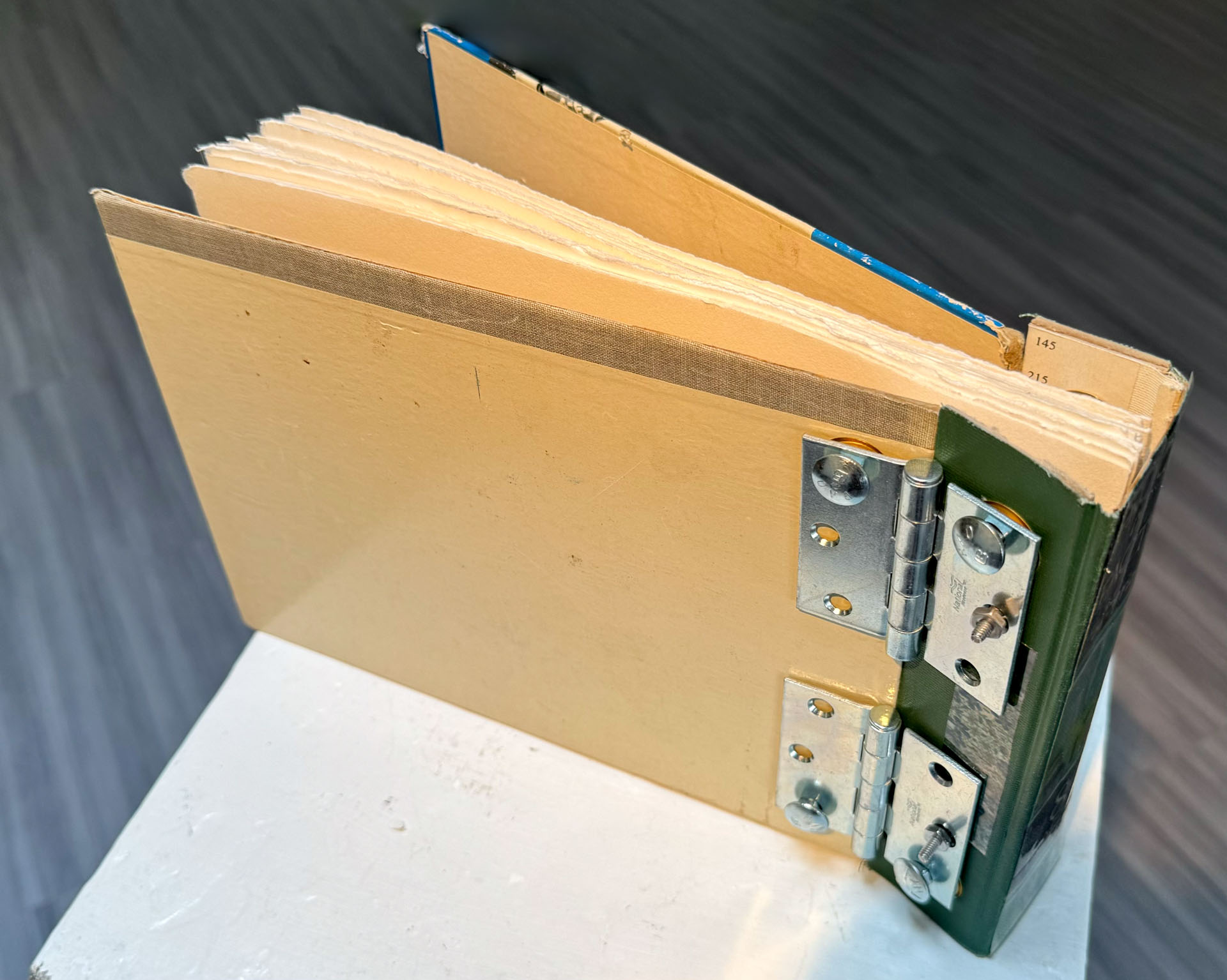 book with hardware binding, copperplate etching, mixed-media collage