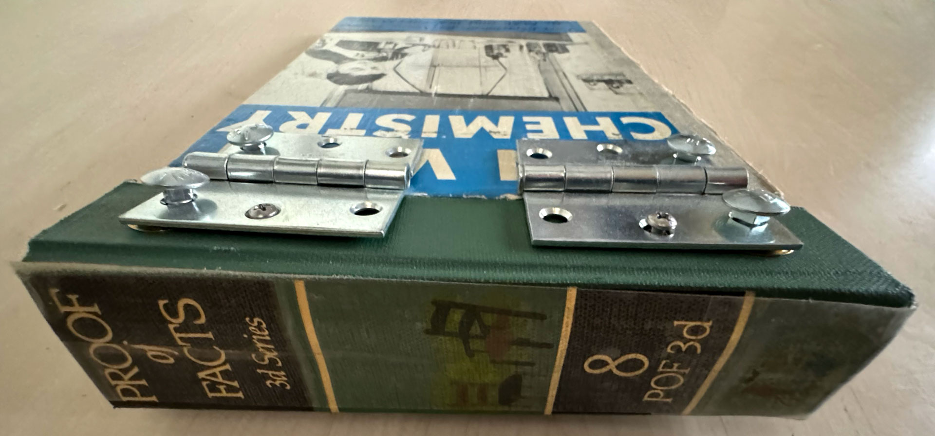 book with hardware binding, copperplate etching, mixed-media collage