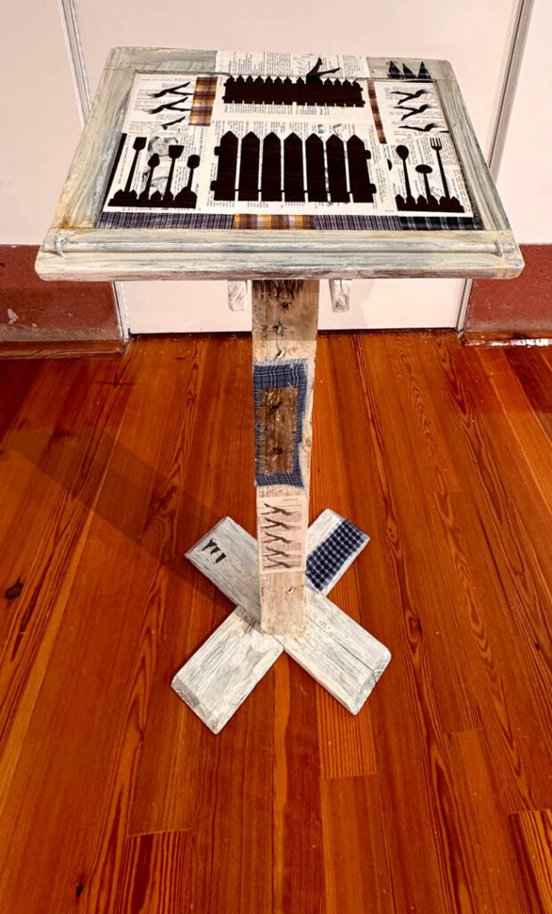 wooden podium with collage, oil paint, audience recorded audio stories